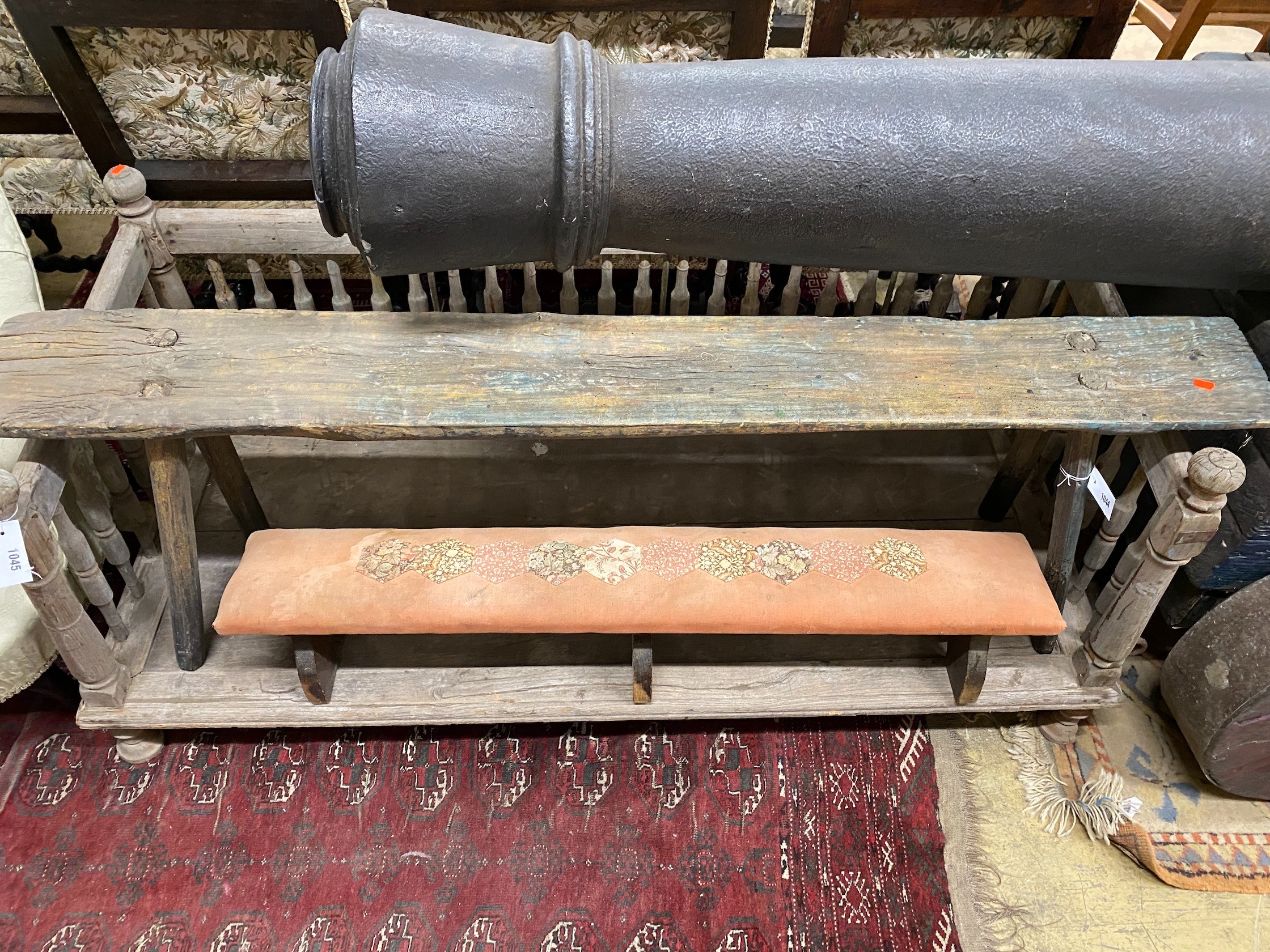 A primitive part painted fruitwood bench, length 150cm, height 48cm together with a smaller fender stool